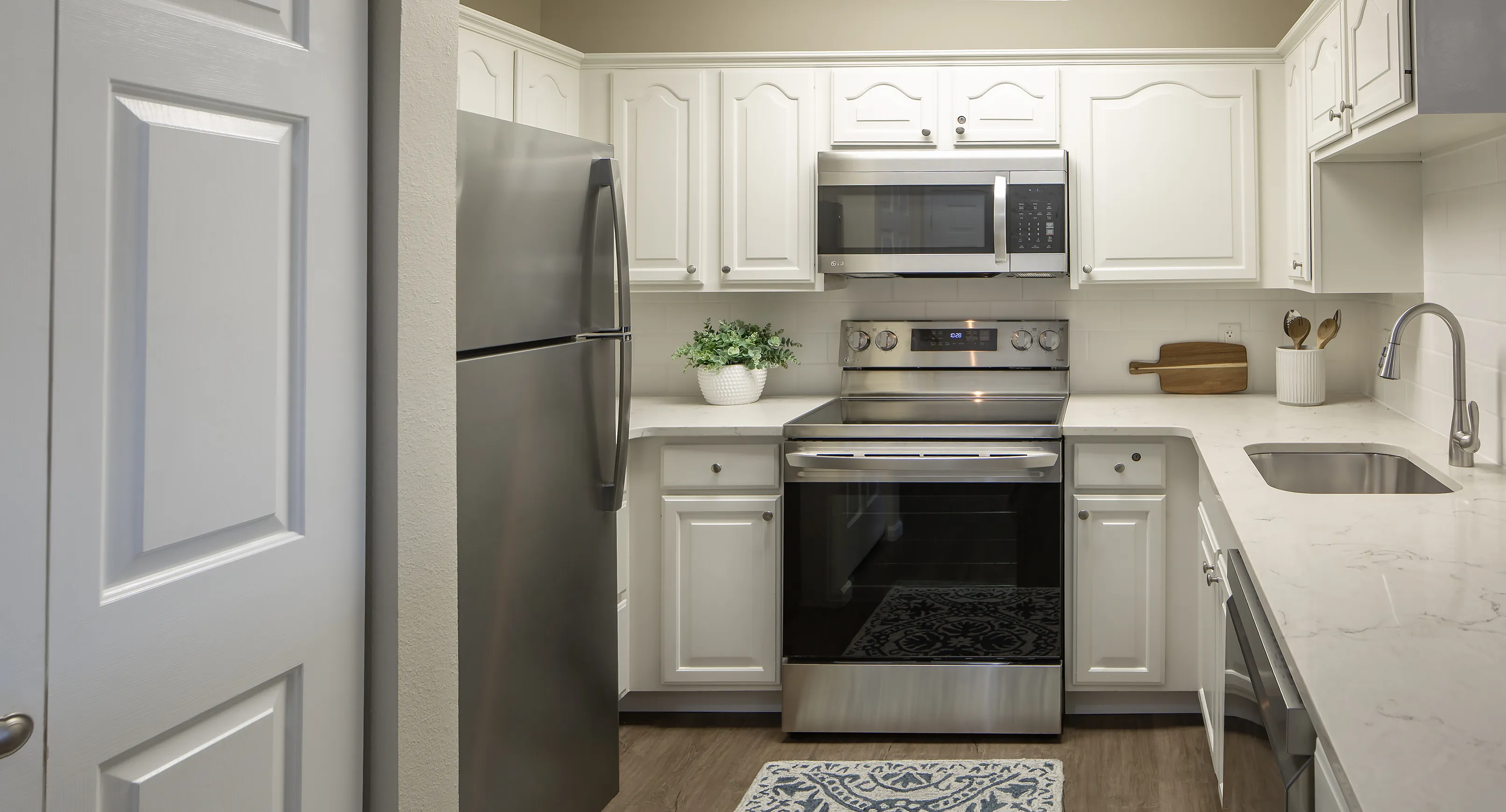 Modern kitchen with a large refrigerator and lots of counter space