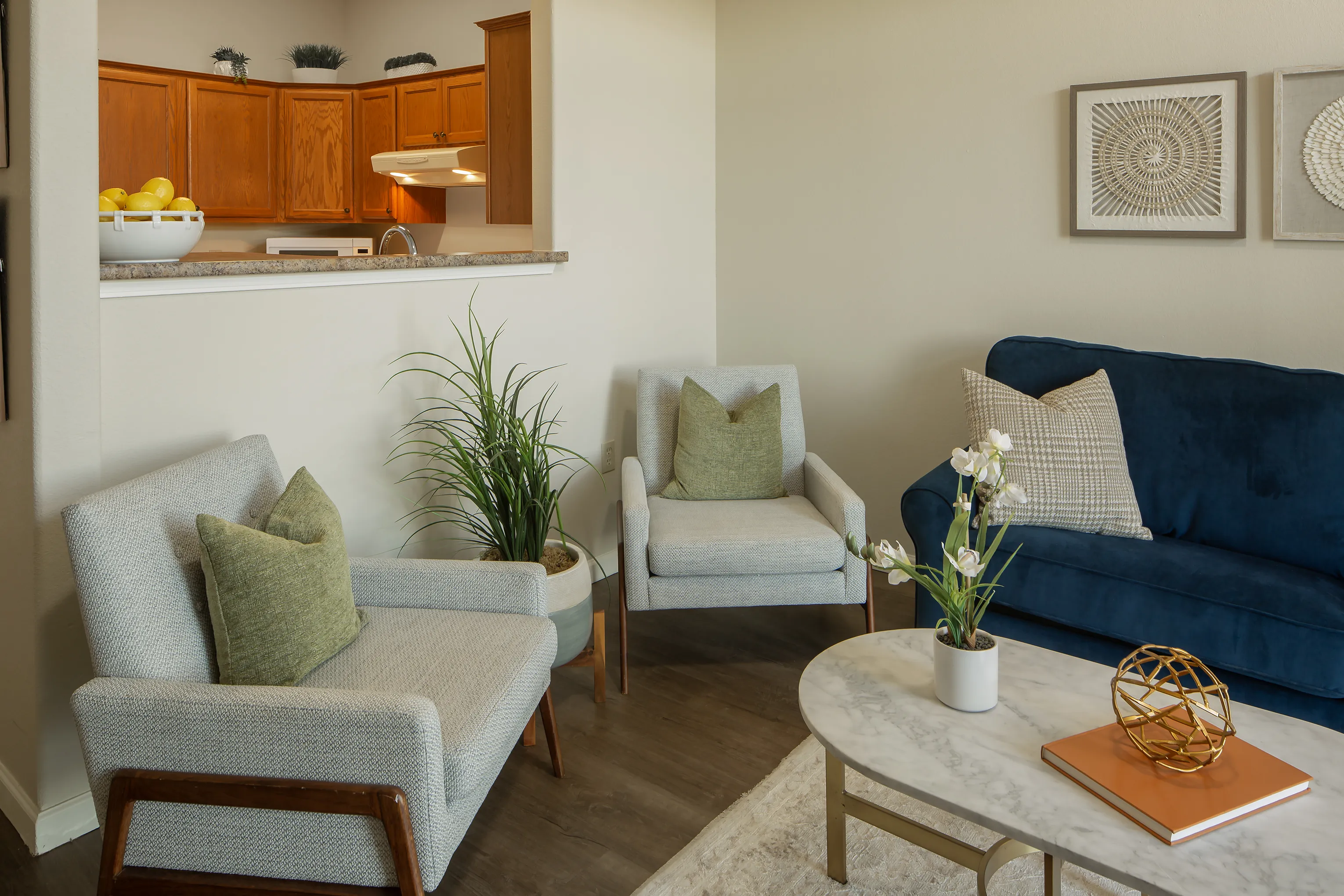 Great room with comfortable seating and a pass-through window to the kitchen
