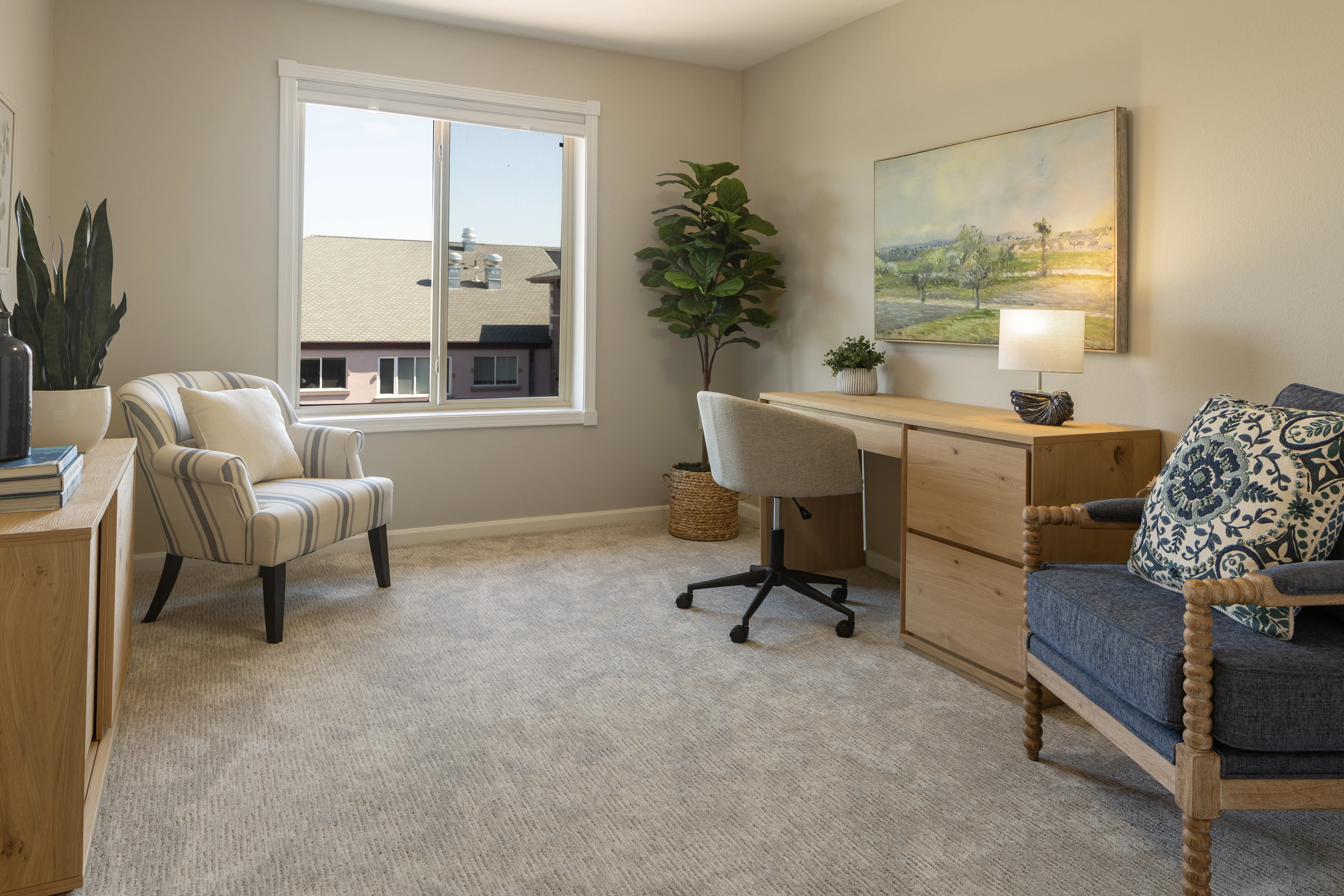 Spacious office space with a desk and extra seating